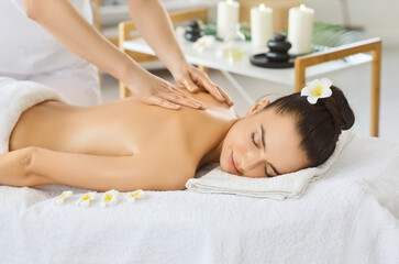 Massage therapist doing aromatherapy, oils massage, woman enjoying relaxing aromas spa, asian...