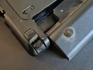 Close-up Laptop battery replacement from an old laptop not used on gray background.
