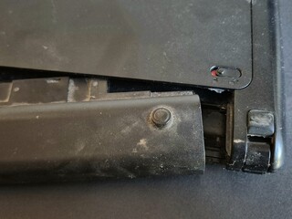 Close-up Laptop battery replacement from an old laptop not used on gray background.