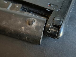 Close-up Laptop battery replacement from an old laptop not used on gray background.