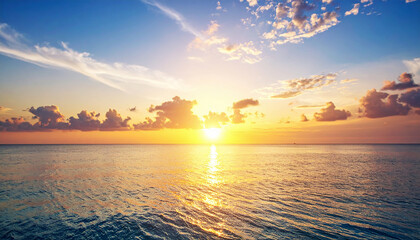 The ocean is peaceful amidst the sunset.