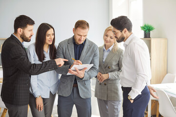 Mentor group coaching, helping office employee with corporate plan, diverse colleagues working on...