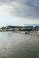 Naklejka premium panorama of bratislava after storm clouds during day with castle on top 