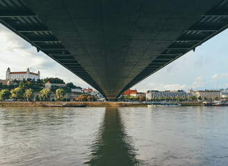 bridge over the river view from under with bratislava old town and castle on left side