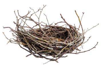 Detailed close-up of an empty bird nest crafted from twigs against black background