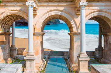 View of Hadrian's Gate in old city of Antalya with Cleopatra beach in Alanya - Antalya, Turkey