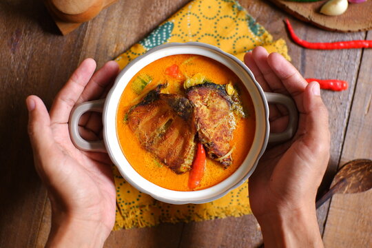 bowl of smoked fish cooked in spicy curry named mangut in Bahasa 