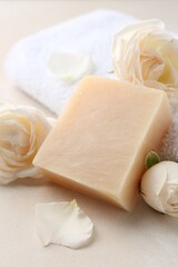 Aromatic soap bar and roses on light table