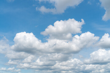 A large number of large white clouds on a clear day.