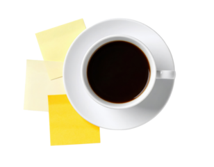 A white cup filled with black coffee on a matching saucer, accompanied by three yellow sticky notes arranged beneath the cup.