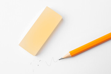 Pencil and eraser on white background, flat lay