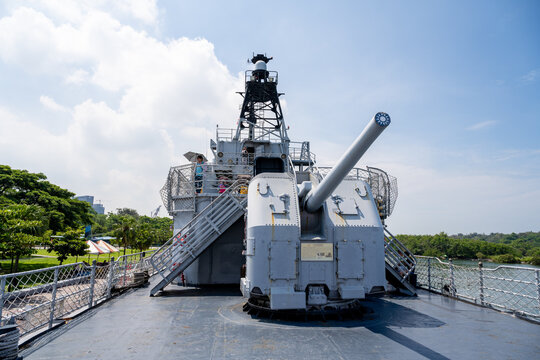 Tainan, Taiwan &ndash; Jun 30, 2025: Historic warship gun turret under blue sky at the Anping Deyang Ship Park. Former US Navy destroyer now serves as a military heritage attraction in southern Taiwan.