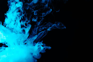 Hookah smoke in blue light on black background, closeup. Space for text