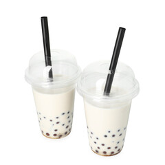 Tasty milk bubble tea in plastic cups isolated on white