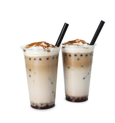 Tasty milk bubble tea in plastic cups isolated on white