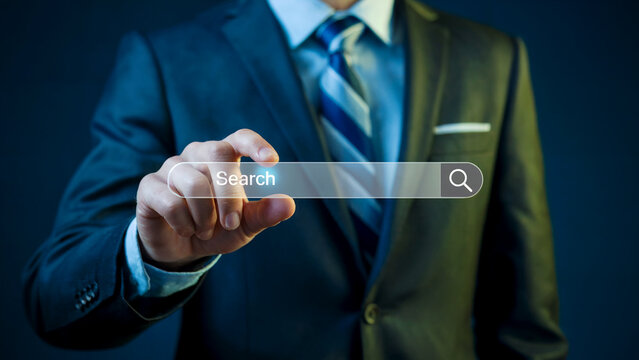 Man in suit touching digital search bar businessman
