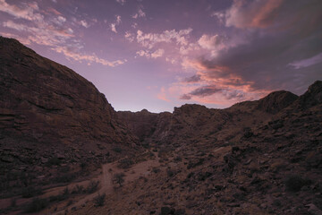 Sunset over an arid canyon with pretty clouds