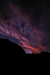 Sunset over an arid canyon with pretty clouds