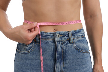 Woman measuring waist circumference on white background, closeup