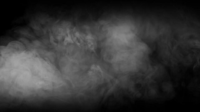 Thick Smoke On A Black Background. Gray Fog. Smoke And Fire. Swirling Smoke Rolling Low Across The Ground.