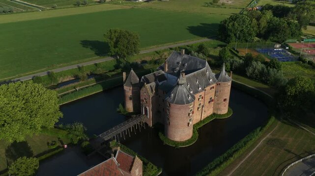 Ammersoyen Castle in Ammerzoden, The Netherlands. Ammersoyen Castle is one of the best preserved medieval castles in the Netherlands. Aerial video.
