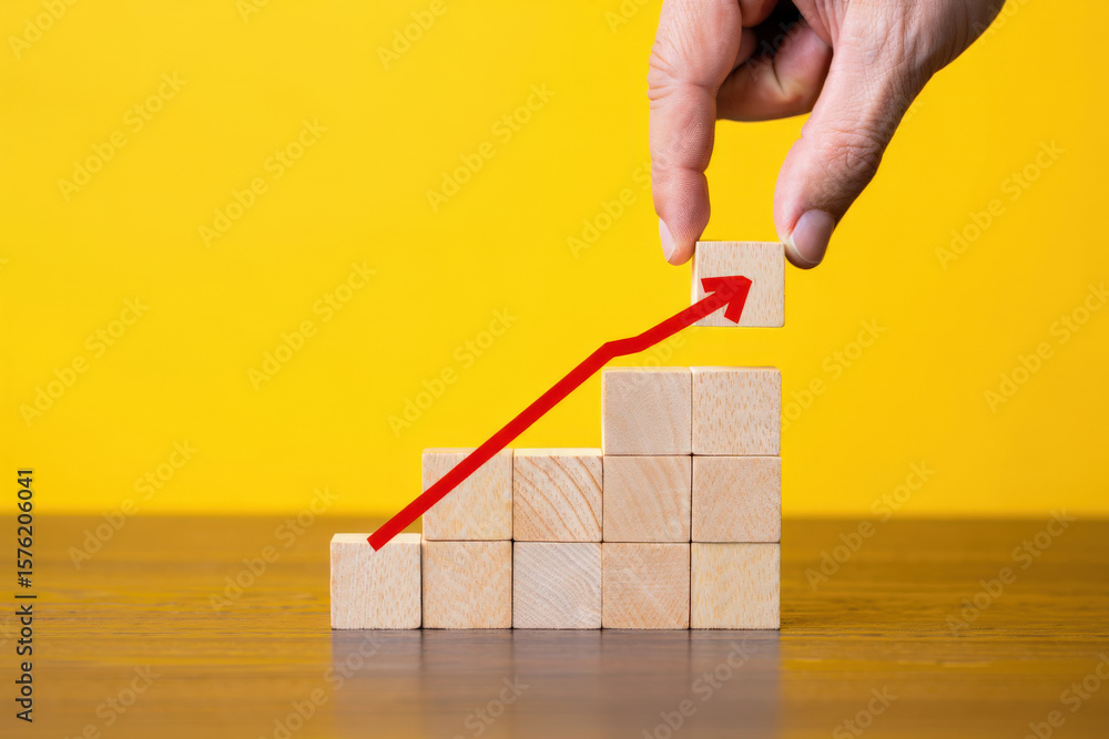 Poster ascending wooden blocks with red arrow symbolizing growth and progress on yellow backdrop representi