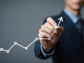Close-Up of a Business Professional Drawing an Upward Trending Graph, Representing Market Growth and Financial Success in a Corporate Setting