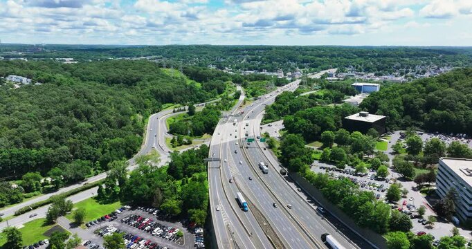 Elmsford, NY, US - July 9, 2025.  Afternoon aerial video over the Elmsford, NY, local commercial buildings and Interstate 87 and 287