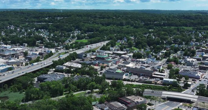 Elmsford, NY, US - July 9, 2025.  Afternoon aerial video over the Elmsford, NY, local commercial buildings and Interstate 87 and 287