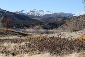 dam and snowy mountain beautiful nature