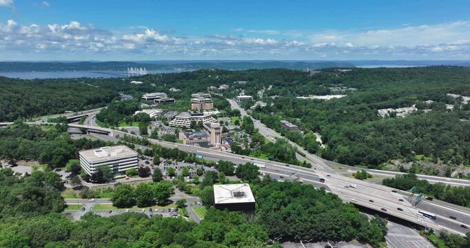 Elmsford, NY, US - July 9, 2025.  Afternoon aerial video over the Elmsford, NY, local commercial buildings and Interstate 87 and 287