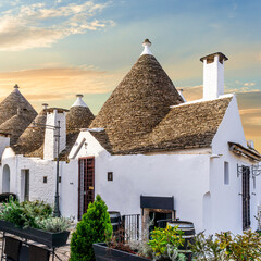 beautiful pretty vintahe houses with blue cloudy sky on background. old mediterranean home for...
