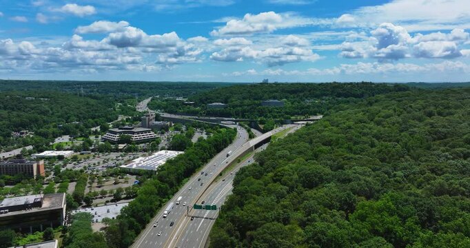 Elmsford, NY, US - July 9, 2025.  Afternoon aerial video over the Elmsford, NY, local commercial buildings and Interstate 87 and 287