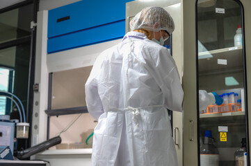 Rear view Caucasian medical lab technician working in hospital laboratory 
