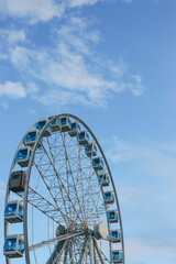ferris wheel against blue sky