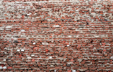 Weathered and Worn Vintage Red Brick Wall in the Honolulu Chinatown District.
