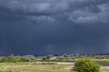 Brok, dark storm clouds over the Bug River, Masovian Voivodeship, Poland