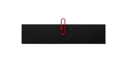 Red paperclip on black surface