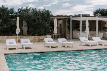 swimming pool in the luxury resort with olive trees	