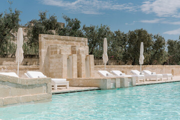 swimming pool in the luxury resort with olive trees	