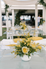 Yellow table setting with lemons and flowers, event, party, wedding decoration, luxury hotel lounge zone	