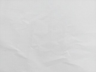 Crumpled white paper texture background with wavy surface. Crumpled white vintage paper surface texture for background. Wrinkled paper, abstract background. Paper background with copy space for text.