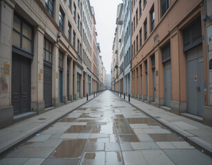 Empty urban street with wet pavement and tall buildings under cloudy sky