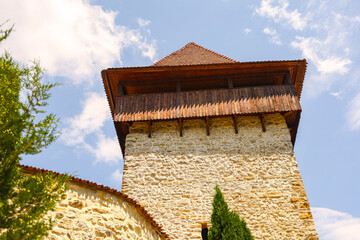 Watchtower on the Outer Wall of Râșnov Fortress – Medieval Stronghold in Romania on a Sunny Day