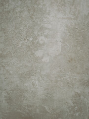 Textured light grey beige surface resembling aged concrete or plaster, ideal for backgrounds,...