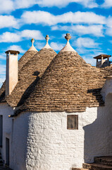 wonderful white mediterranean architecture of italian buildings with sdtrange conic roofs and wfite vintage walls and windows