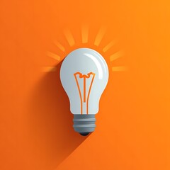 Glowing lightbulb on orange, symbolizing idea