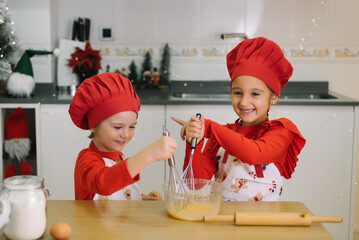 Children baking festive christmas cookies together