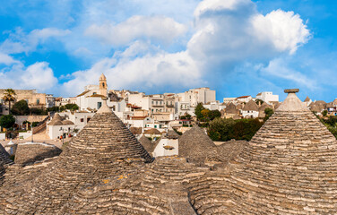 beatiful roofs in old vintage style with picturesque cloudy sly on background. Antique architecture of european buildings.