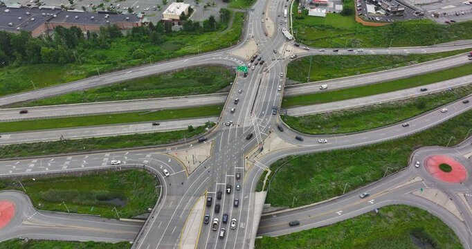 Aerial, drone, afternoon video of a diverging diamond interchange (DDI), located in Woodbury, NY